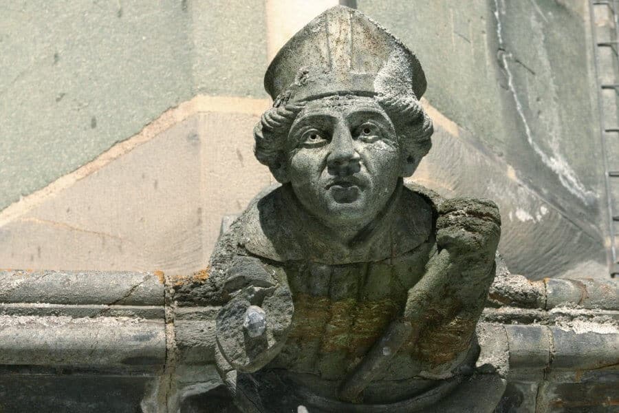 Stone carving of Catholic Bishop on a church