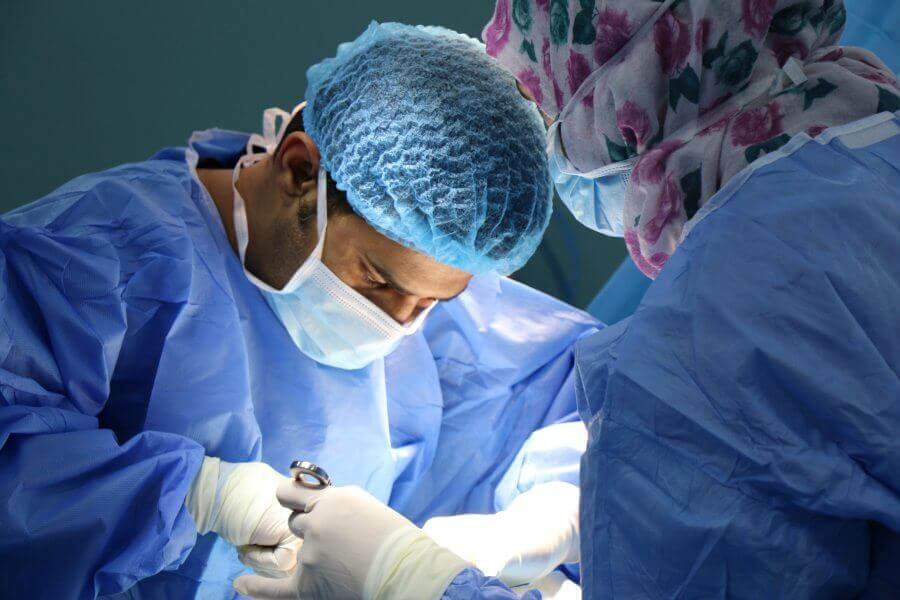 Surgeons operating on a patient.
